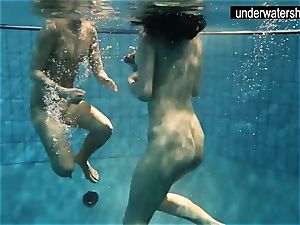 two splendid amateurs flashing their figures off under water